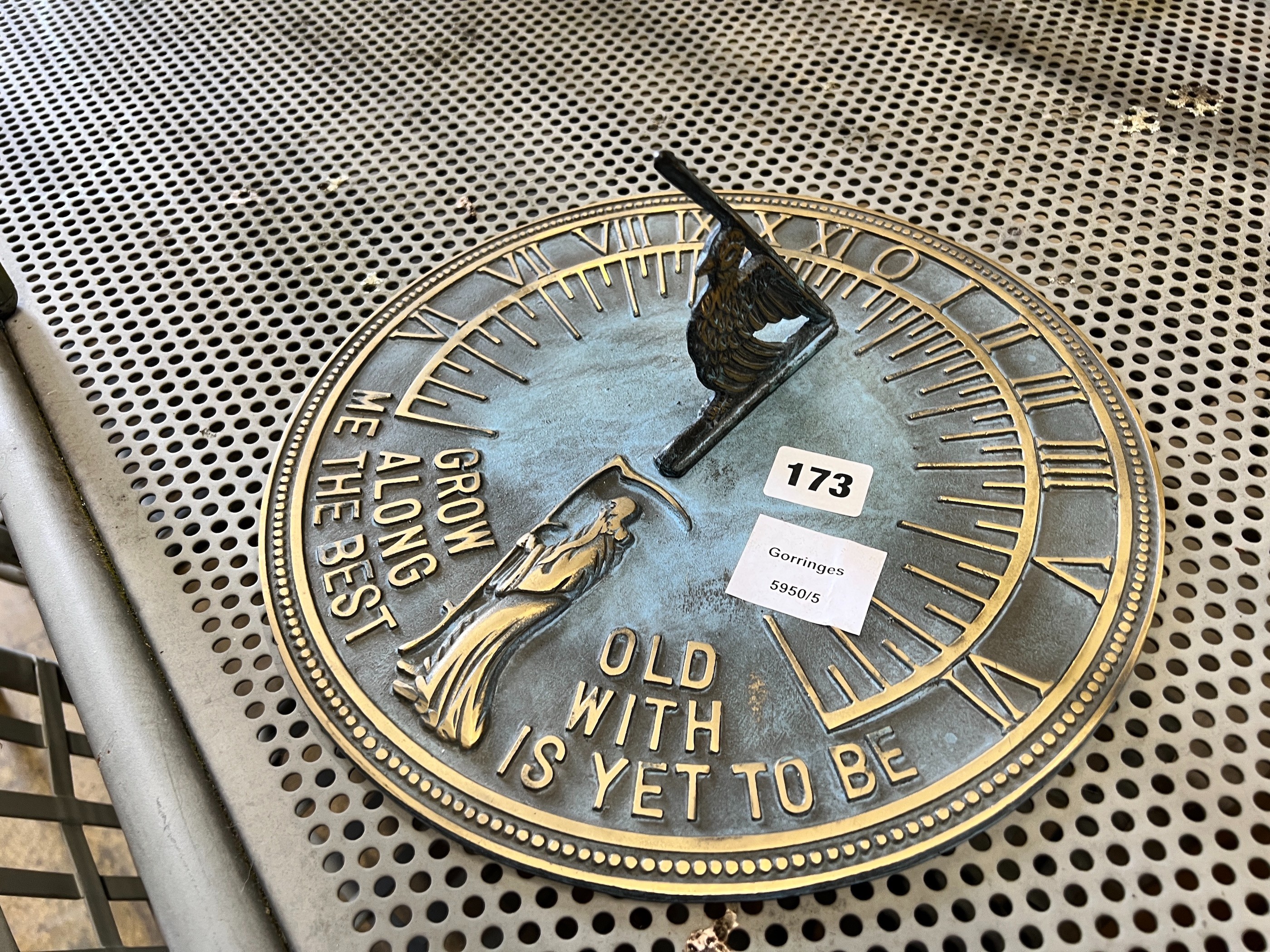 A modern painted metal circular sun dial, diameter 28cm